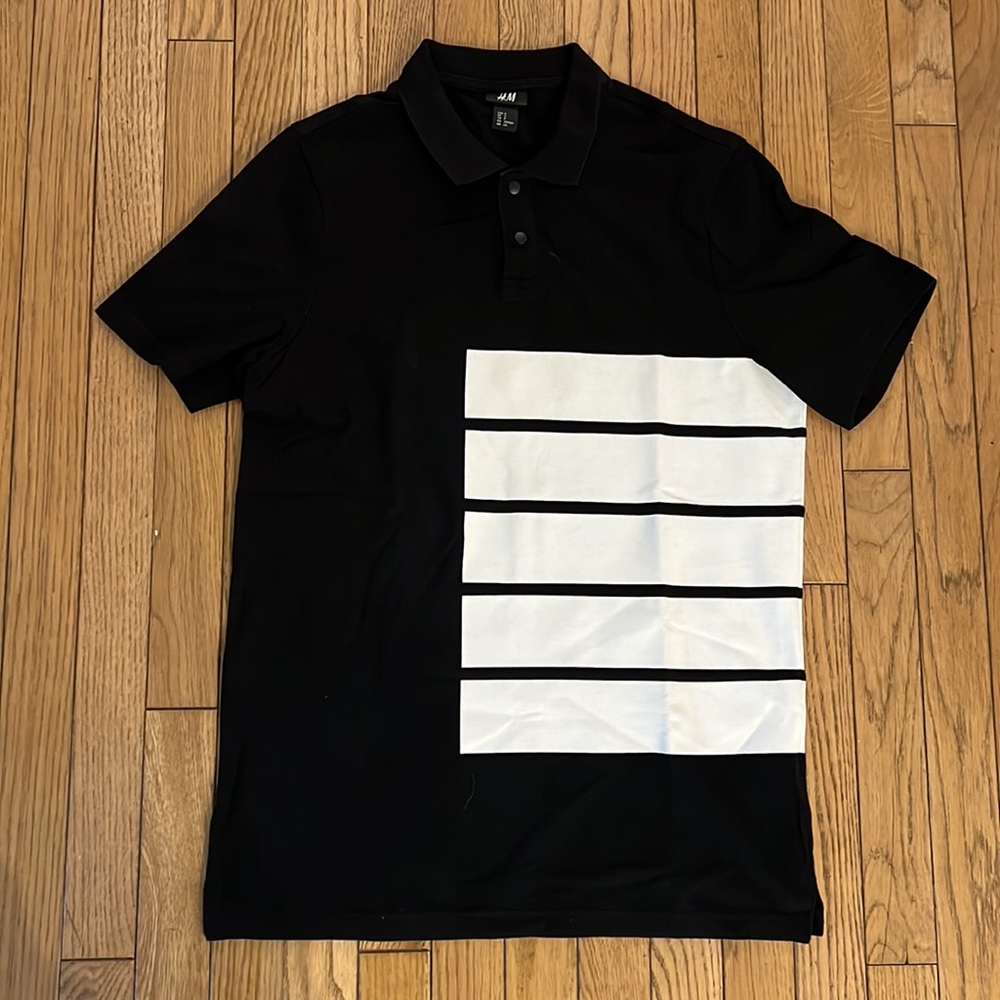 Black polo shirt with white design